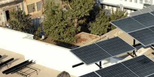 Raised solar structure on Asif Ali Gujjar's roof